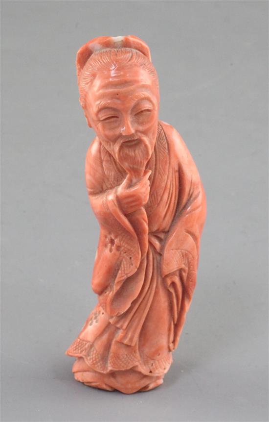 A Chinese coral figure of a sage, mid 20th century, height 9.4cm